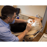 ENT ear procedure using specialized surgical equipment.png